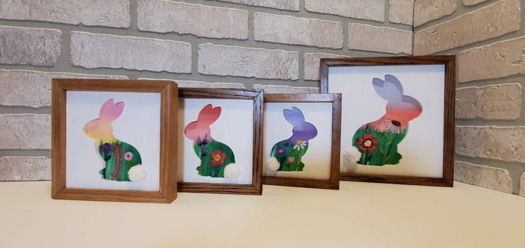 Examples of side profile bunnies silhouette with embroidered floral designs on the inside.