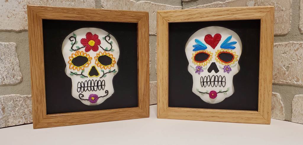 Examples of skull silhouettes with embroidered flowers, hearts, face details.