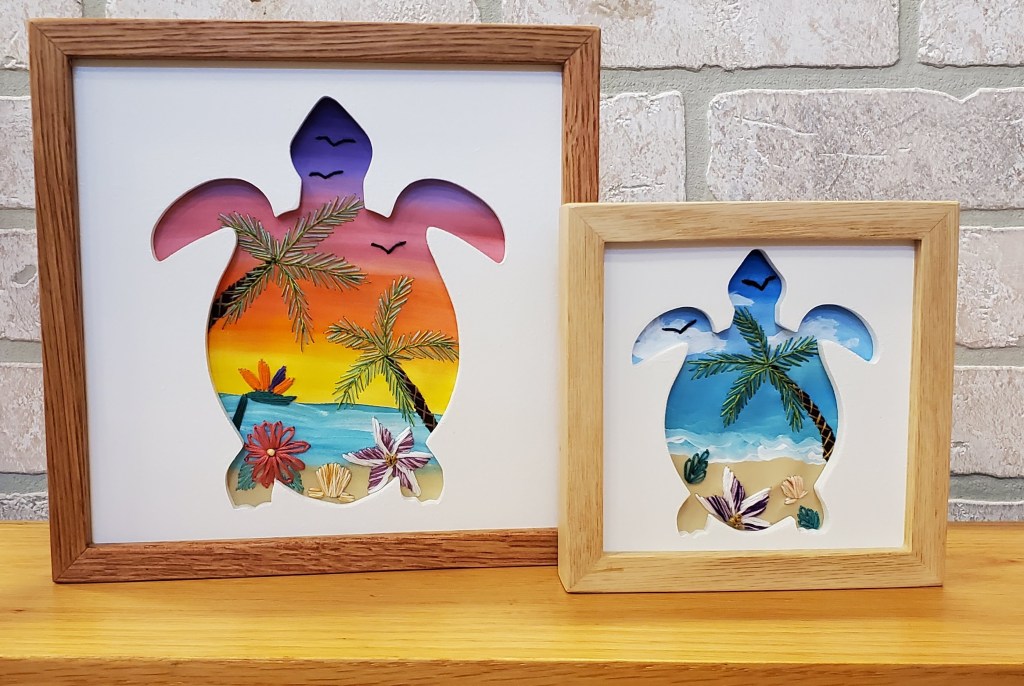 Small and large sea turtle silhouettes with beach scenes and embroidered palm tree and tropical plant details.