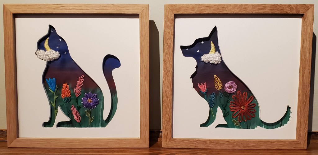 Cat and Dog sitting side view silhouettes. Dark sky night scene background with embroidered moon and clouds and flower details.